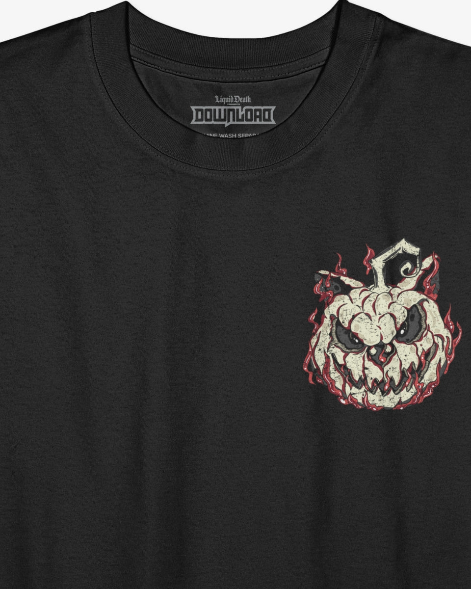 Close-up of the Download Admit One Soul Halloween T-shirt showing the carved pumpkin-style Download dog graphic with flames, printed on black fabric. 'Liquid Death' and 'Download' branding visible on the inside neck label.