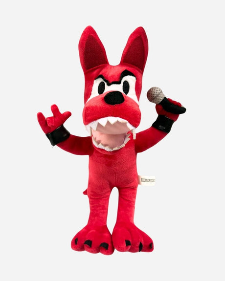 The 2025 Anime Plush Dog is a red plush toy with big ears, black eyebrows, sharp white teeth, and an expressive cartoon face. It holds a microphone in one hand, makes a rock on gesture with the other, and has black paws.