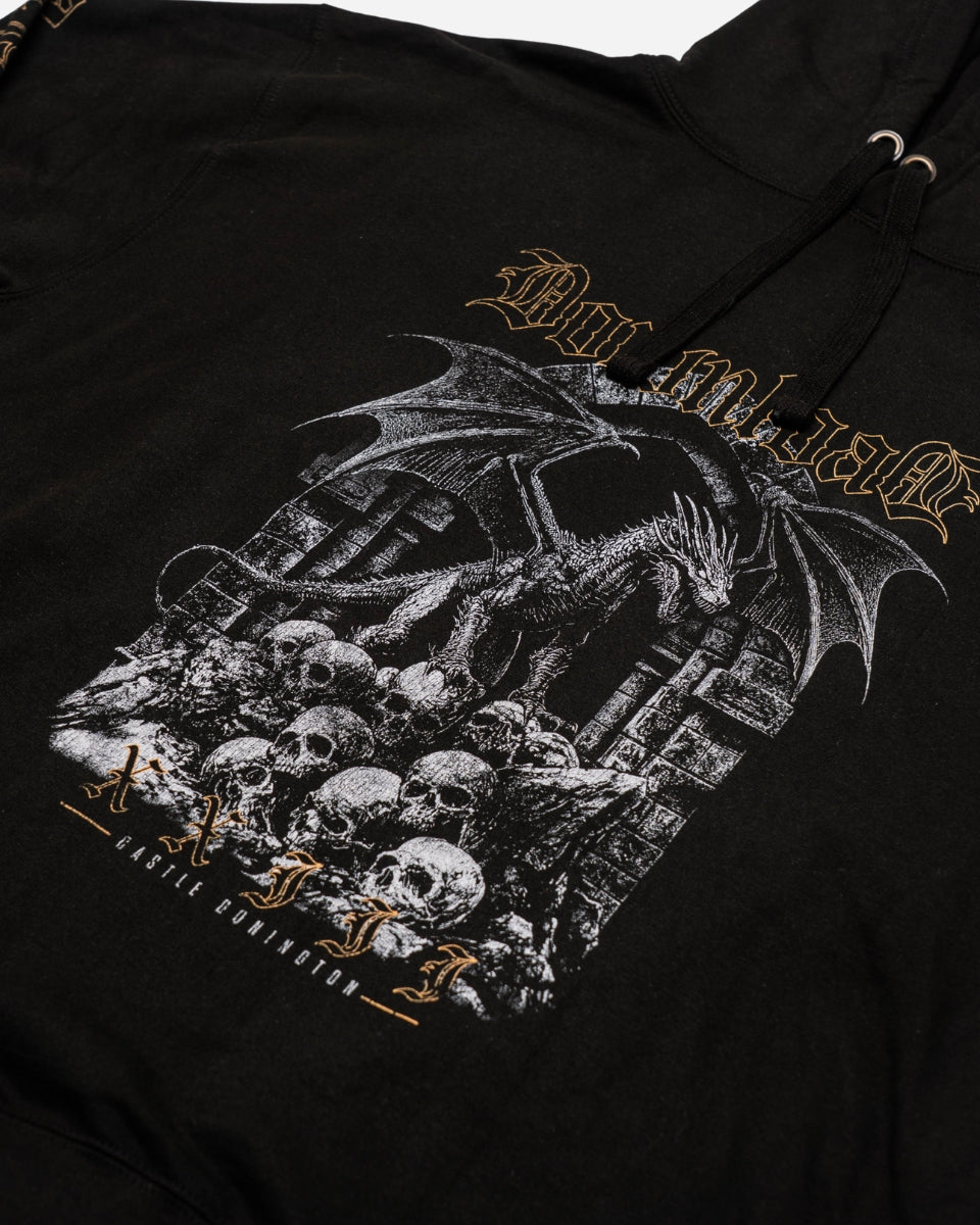 The PRE-ORDER 2026 Exclusive Line-Up Hoodie from Download Festival Shop features a dragon on stone ruins above skulls, gothic-style text, and “Castle Conqueror” below. This online exclusive is a must-have for devoted fans.