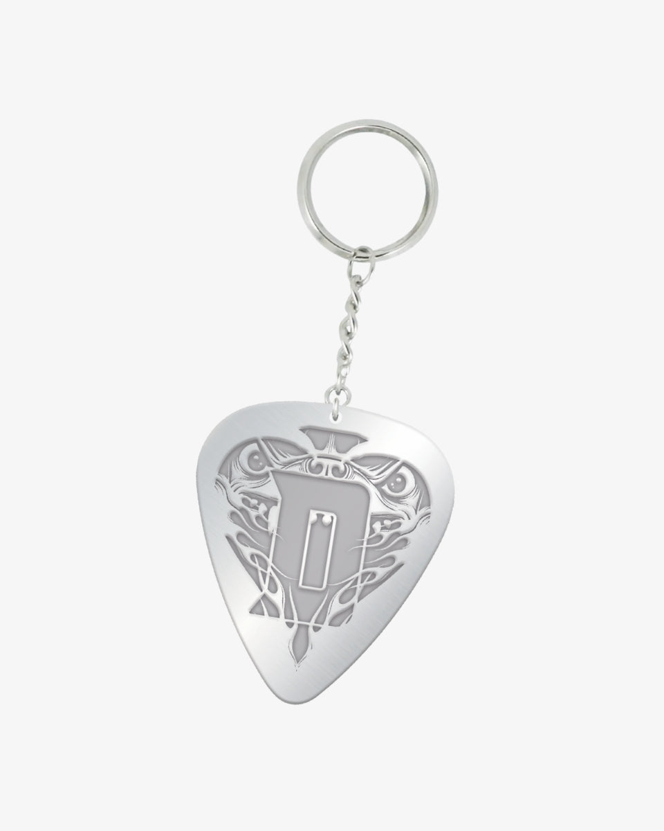 Metal plectrum-shaped keyring with a detailed engraving of the Download dog face and a bold raised letter “D” at the centre, attached to a silver chain and ring.