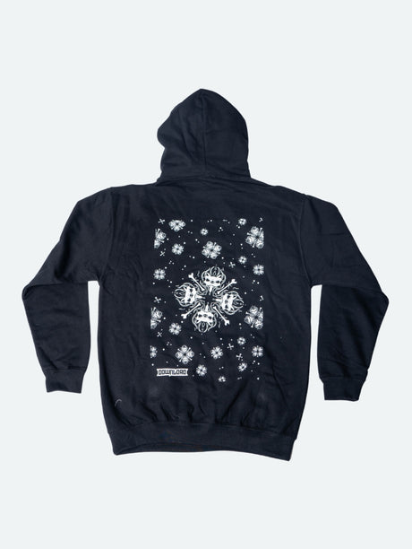 Back view of a black hoodie featuring a large central white snowflake design composed of mirrored snarling dog heads and crossed bones, surrounded by smaller matching snowflakes and symbols, with the Download logo near the hem.
