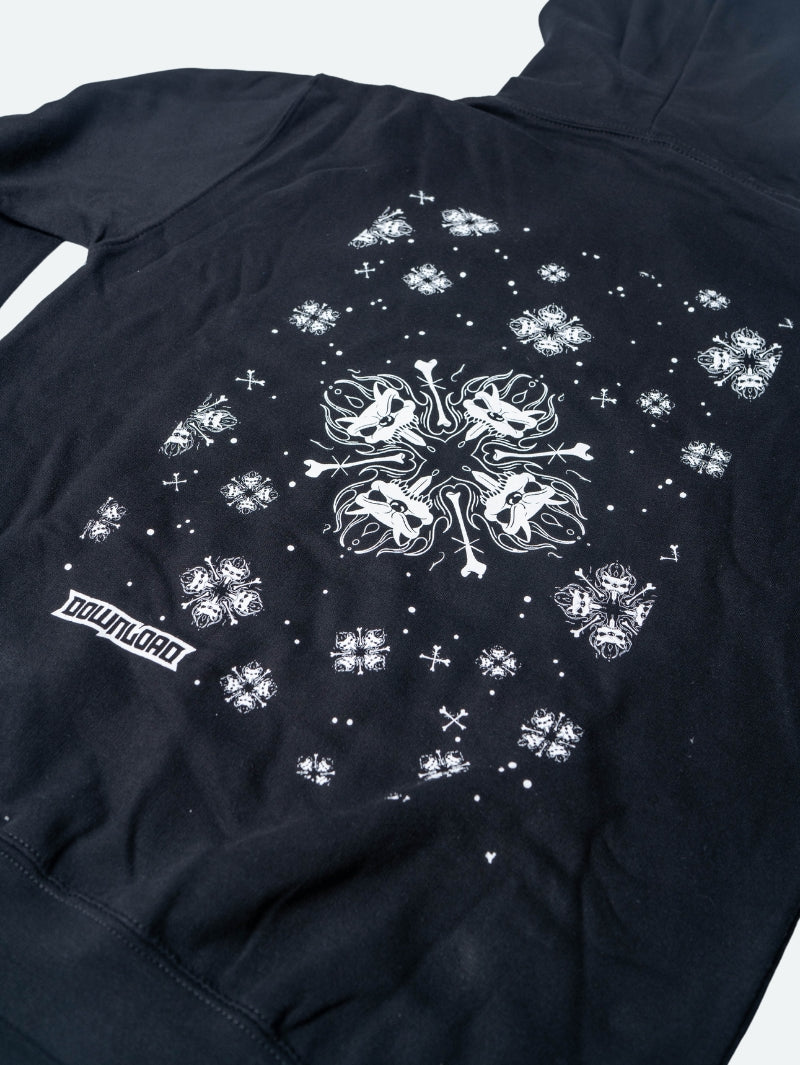 Close up back view of a black hoodie featuring a large central white snowflake design composed of mirrored snarling dog heads and crossed bones, surrounded by smaller matching snowflakes and symbols, with the Download logo near the hem.