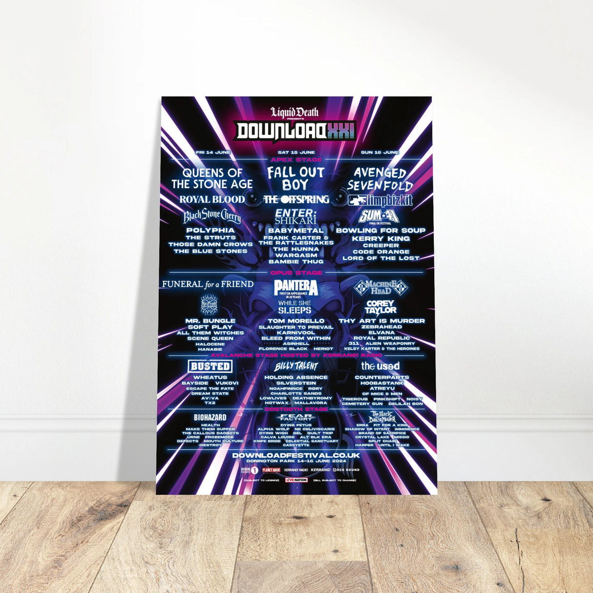 The Download 2024 Line Up Poster A2 from Download Festival Shop features Queens of the Stone Age, Fall Out Boy, and Avenged Sevenfold on a black background with neon purple lines, printed on semi-glossy paper with event details at the bottom.