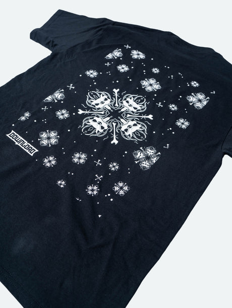 Close up of the back view of a black hoodie featuring a large central white snowflake design composed of mirrored snarling dog heads and crossed bones, surrounded by smaller matching snowflakes and symbols, with the Download logo near the hem.