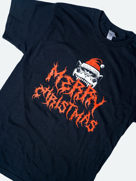 Close up of the black short-sleeve t-shirt featuring a snarling Download Festival dog wearing a red Santa hat, positioned above the words "Merry Christmas" in jagged, flame-like lettering.