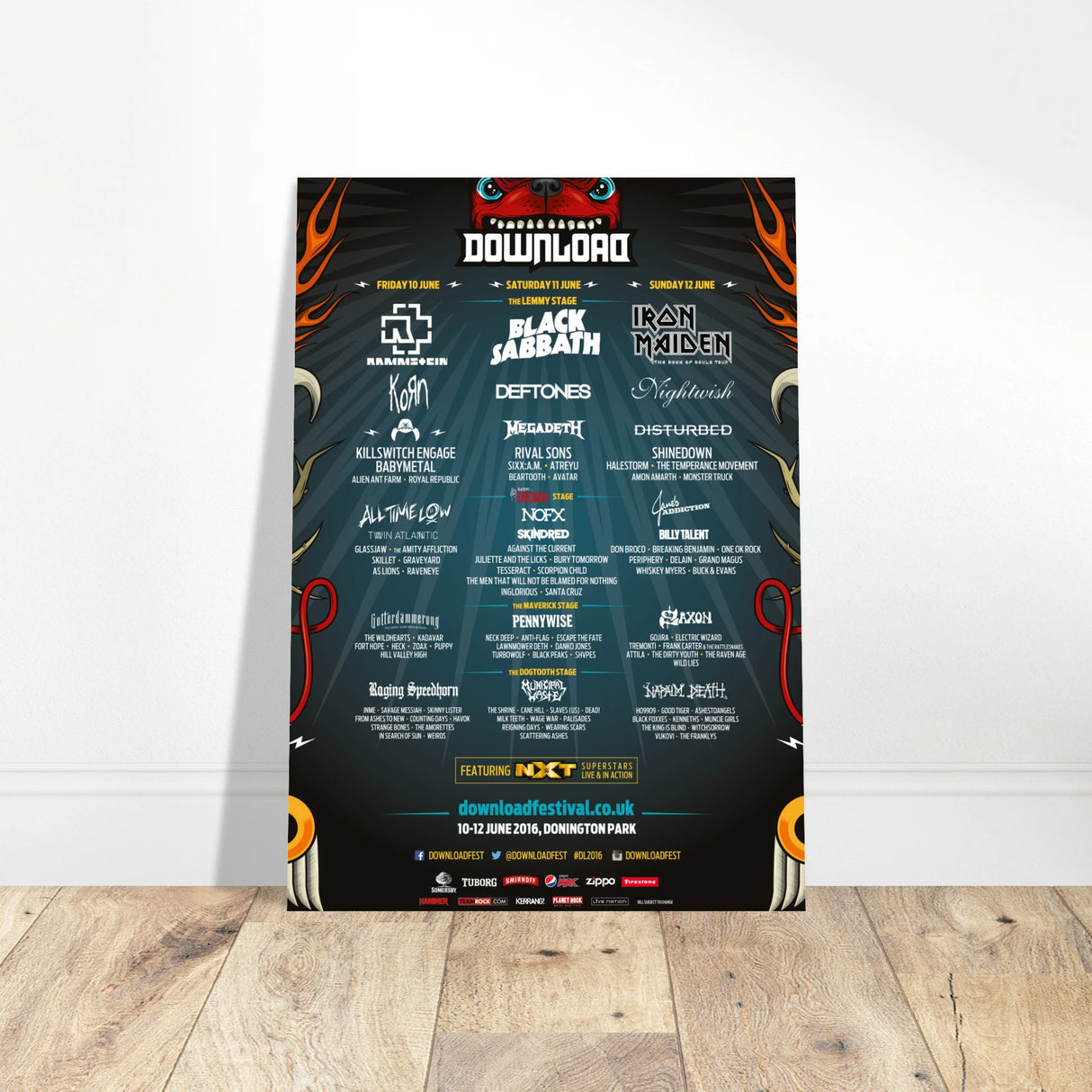 The Download Festival Shops Download 2016 Line Up Poster A2 features Rammstein, Black Sabbath, and Iron Maiden on semi-glossy 170 gsm sustainable paper with full band line-up and event details on a dark background, leaning against a white wall.