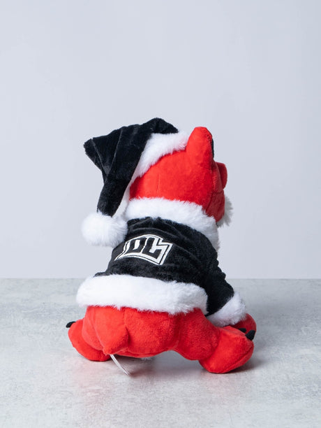 Rear view of a red plush Download Dog toy dressed in a black and white Santa outfit, featuring a fluffy trim and a Santa hat, with a bold white "DL" logo on the back of the jacket.