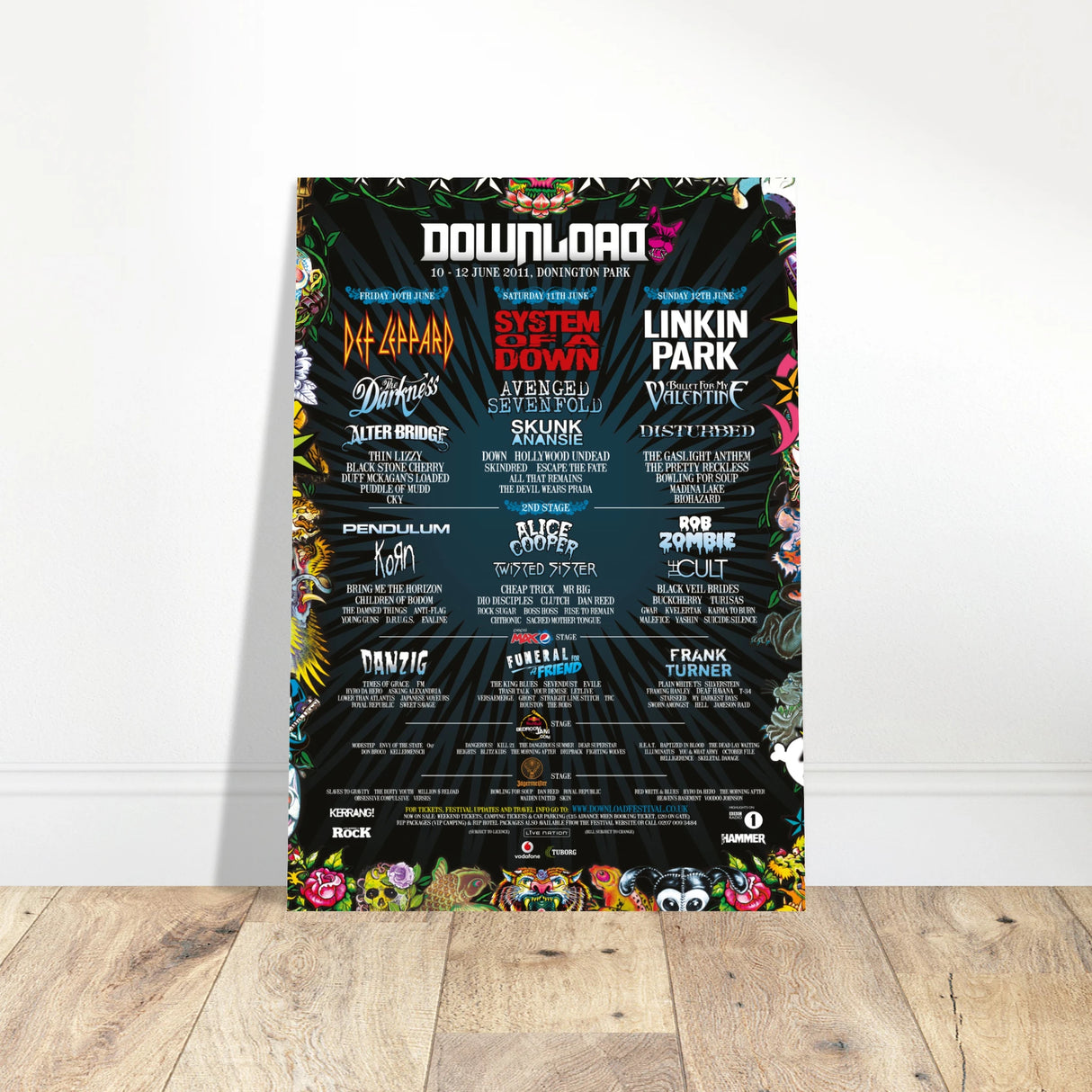 The Download 2011 Line Up Poster A2 from Download Festival Shop features colorful band names, headliners Def Leppard, System of a Down, and Linkin Park, plus vibrant festival details printed on high-quality semi-glossy paper.