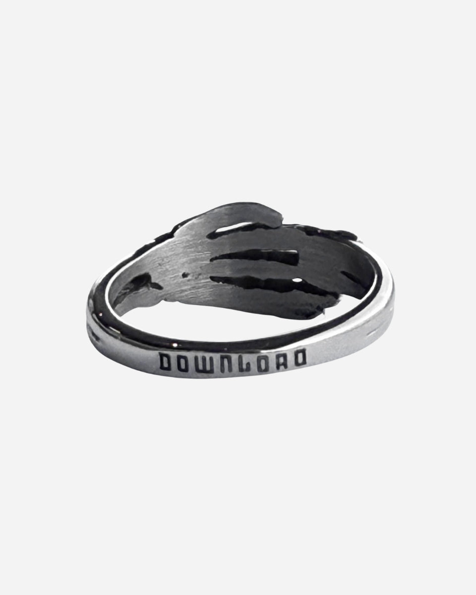 The 2025 Skeleton Ring is a silver ring shaped like a hand wrapping around your finger, with DOWNLOAD engraved on the outer band.