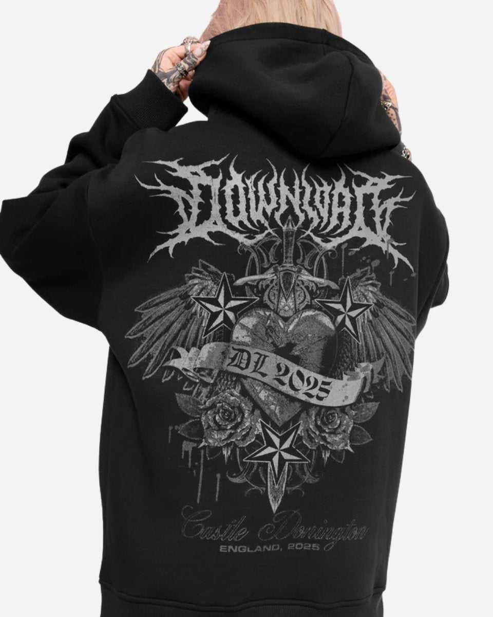 Someone wears the Mary Wyatt Next Gen Pullover Hoodie by 2025, a black hoodie with a gothic graphic on the back showing wings, roses, stars, a sword, and text: DL 2025 and Castle Donington, England, 2025.