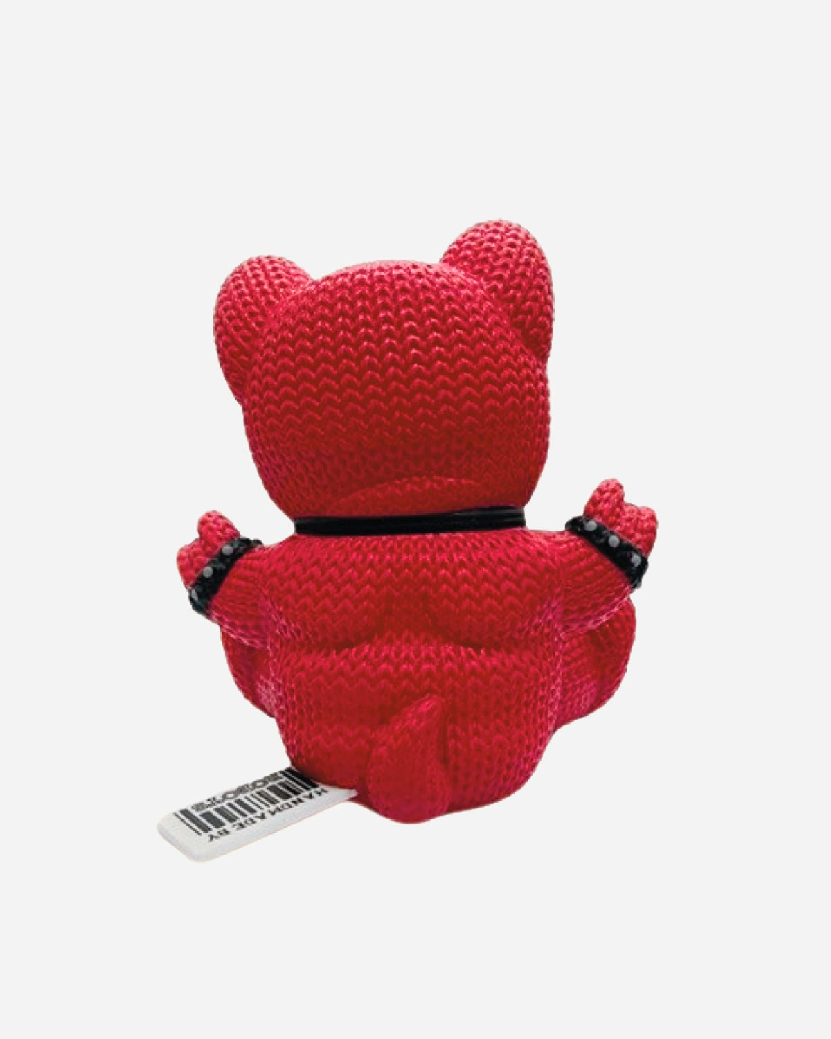 The Hand Made by Robots Download Vinyl Dog by Download 2026 sits facing away, showing its back, ears, and upraised arms. It features a black beaded bracelet, a side tag, and is set against a plain white background.
