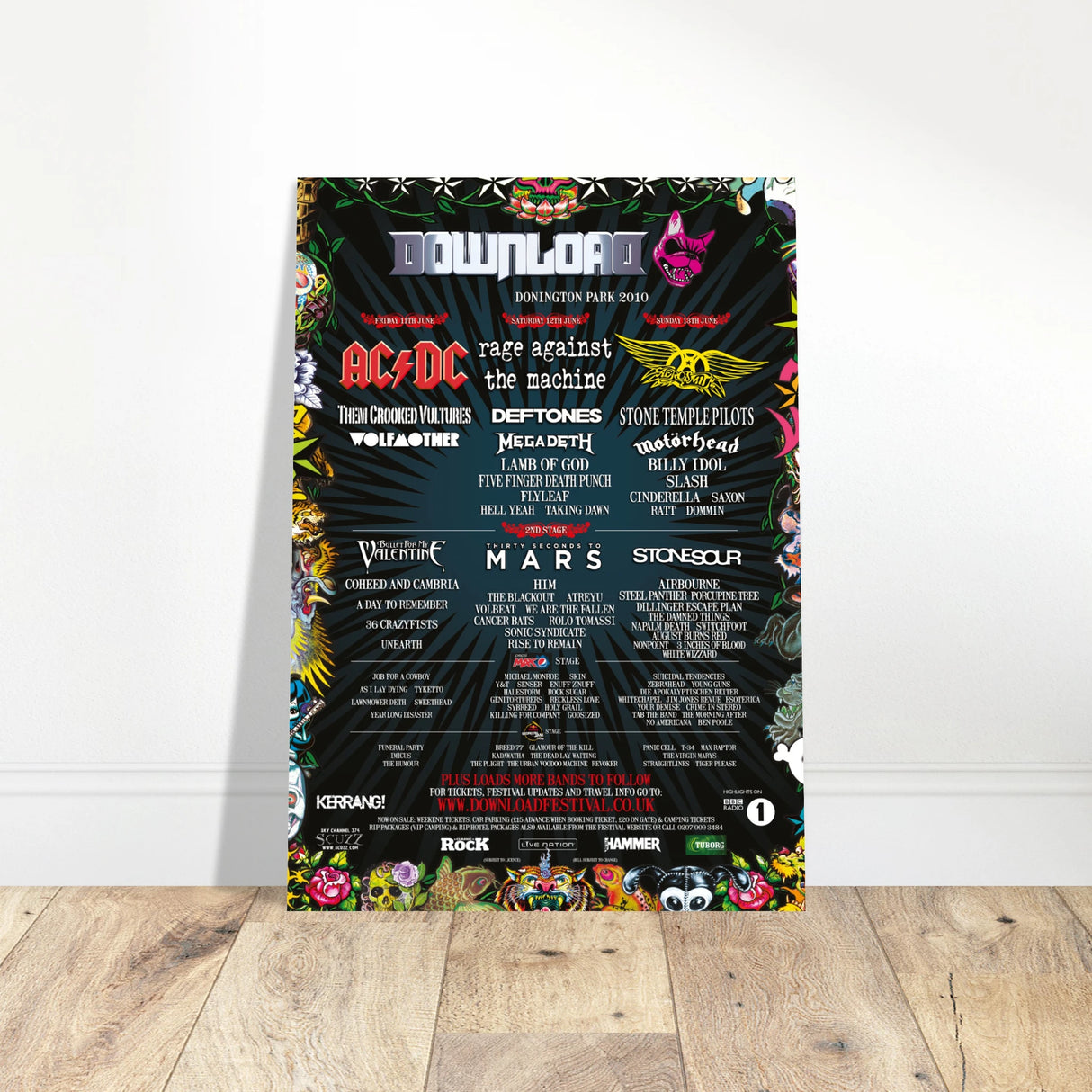 The Download Festival Shop’s Download 2010 Line Up Poster A2 features that year’s band lineup in bold text on FSC-certified semi-glossy paper, with vivid graphics framing the dark edges for a striking display.