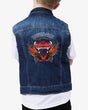 Back of the Kids’ blue denim battle jacket featuring a large graphic of the Download Festival dog logo with flames and 'Download' text above, worn over a white T-shirt.