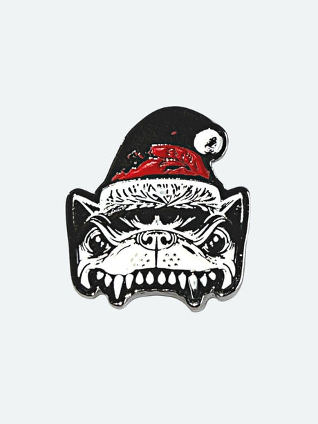 Enamel pin badge featuring the snarling face of the Download Festival dog mascot wearing a red and black Santa hat with white trim and pom-pom, against a plain light grey background.
