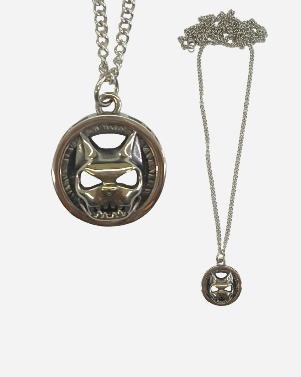 The Download 2026 Dog Head Necklace features a round pendant with a stylized dog head design, shown in close-up and full view on a plain white background.