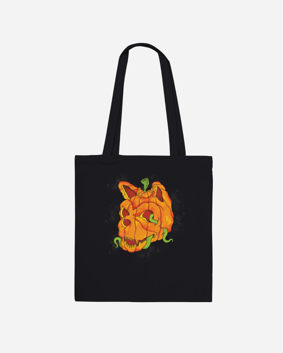 The Download Pumpkin Head Black Tote Bag from the Download Festival Shop is a made-to-order black tote bag featuring an illustration of a carved pumpkin with a sinister skull face and green vines. With its long handles, this unique cotton tote combines spooky style and practicality—perfect for fans of distinctive accessories.