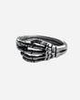 The Skeleton Ring by 2025 features a silver skeletal hand design that wraps around the finger, with detailed bone accents on a simple band.
