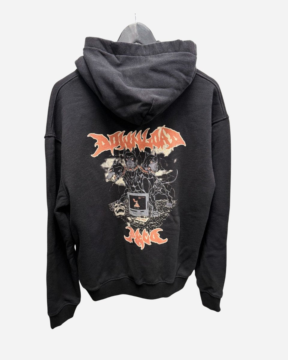 The 2025 P&Co Unisex Cerberus Hoodie is black with a vibrant back graphic of three figures, lightning, and bold DOWNLOAD and J4WC text. Shown hanging on a hanger against a plain background.