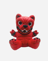 The Hand Made by Robots Download Vinyl Dog by Download 2026 features a playful, cartoonish design with big eyes, a wide mouth, and black-tipped paws, sitting with arms and legs spread in the brand's signature knit-toy style.