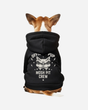 A small brown and white dog faces away, wearing the Download 2026 Mosh Pit Crew Dog Hoody featuring a cat face graphic and "Official Pup Mosh Pit Crew" printed on the back.