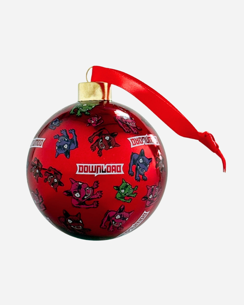 The 2025 Download Glass Bauble is a shiny 12cm ornament featuring colorful cartoon dog faces and "DOWNLOAD" text, finished with a red ribbon, gold topper, and presented in a festive box.