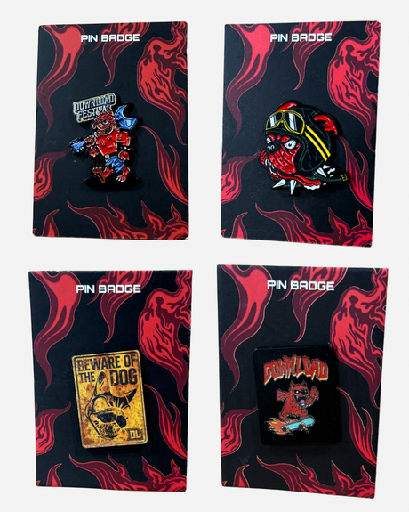 Four Download 2026 Pin Badges, each presented on a black card with a flame design: featuring the festival monster mascot, a bulldog wearing goggles, a “Beware of the Dog” sign, and a skateboarding dog with the Download logo.