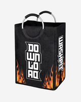 The Wash Pit Laundry Bag by Download 2026 features a black design with metal handles, orange flames at the bottom, bold white "DOWNLOAD" text on the front, and "WASHKIT" in vertical stylized letters on the side.