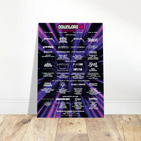The Download 2023 Line Up Poster A2 from Download Festival Shop features bands like Metallica, Slipknot, and Bring Me The Horizon on a purple and black design, printed on semi-glossy paper and displayed against a white wall.
