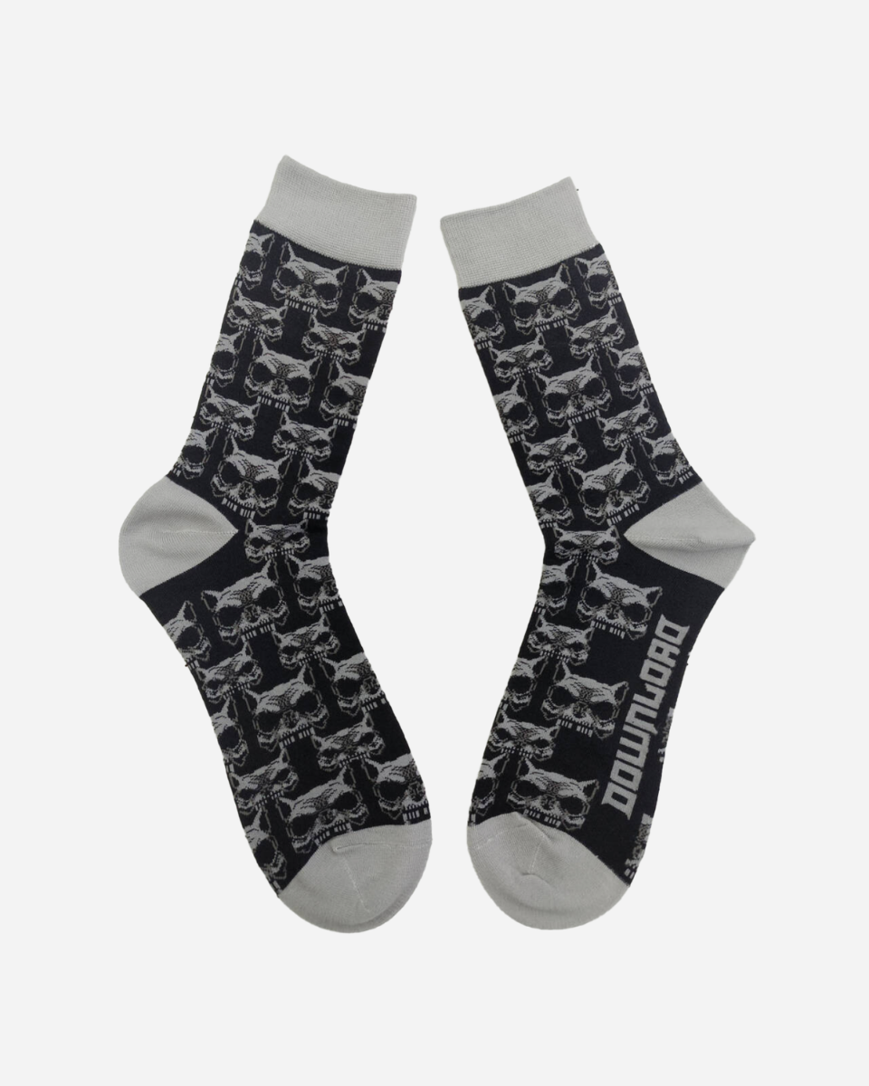 The Beast Socks by Download 2026 are black with gray toes, heels, and cuffs, feature a repeating skull pattern, and have "DOWNLOAD" printed in white on the sole of one sock.