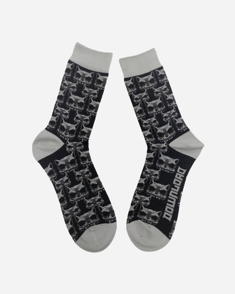 The Beast Socks by Download 2026 are black with gray toes, heels, and cuffs, feature a repeating skull pattern, and have "DOWNLOAD" printed in white on the sole of one sock.