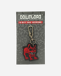 The Pixel Dog Keychain by Download 2026 features an 8-bit style red dog charm on a grey card labeled with the brand and product name, complete with a metal clasp and key ring.
