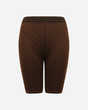 Download 2026 Animal Print Cycling Shorts are brown, knee-length, fitted shorts featuring a subtle black geometric pattern and an elastic waistband, shown against a plain white background with no visible pockets or embellishments.