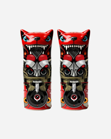 The Totem Salt and Pepper Shakers by Download 2026 feature two stylized cat figures with fierce expressions, sharp teeth, and detailed red, black, and gray tribal patterns on a white background.
