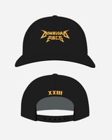 The P&Co Logo Cap by Download 2026 is a black snapback featuring a bold yellow Download 2026 logo in a metal-style font on the front and XXVI in yellow above the adjustable strap on the back.