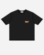 The P&Co Unisex Cobra Tee by Download 2026 is a black short-sleeve t-shirt featuring a small, colorful graphic logo on the left chest and a plain design with no additional patterns.